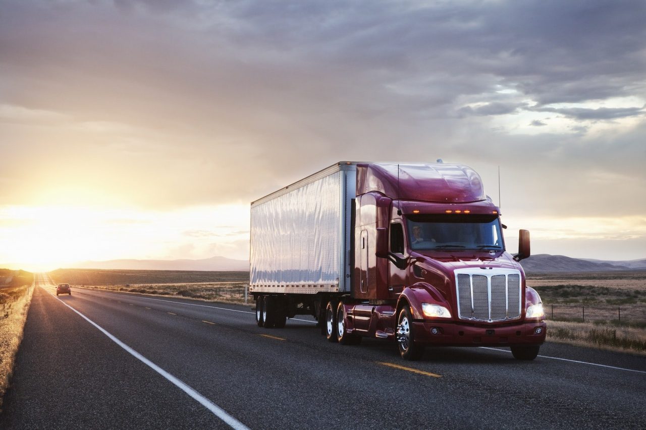 4 front view of a commercial truck on the road at sunset in eastern washington usa e1665412064608